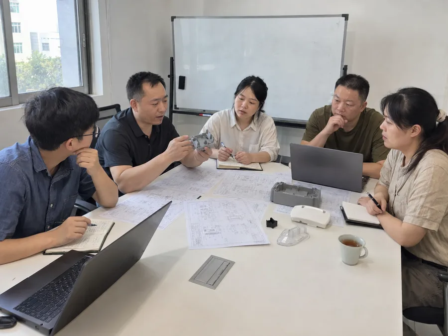 A project meeting over mould drawings and parts